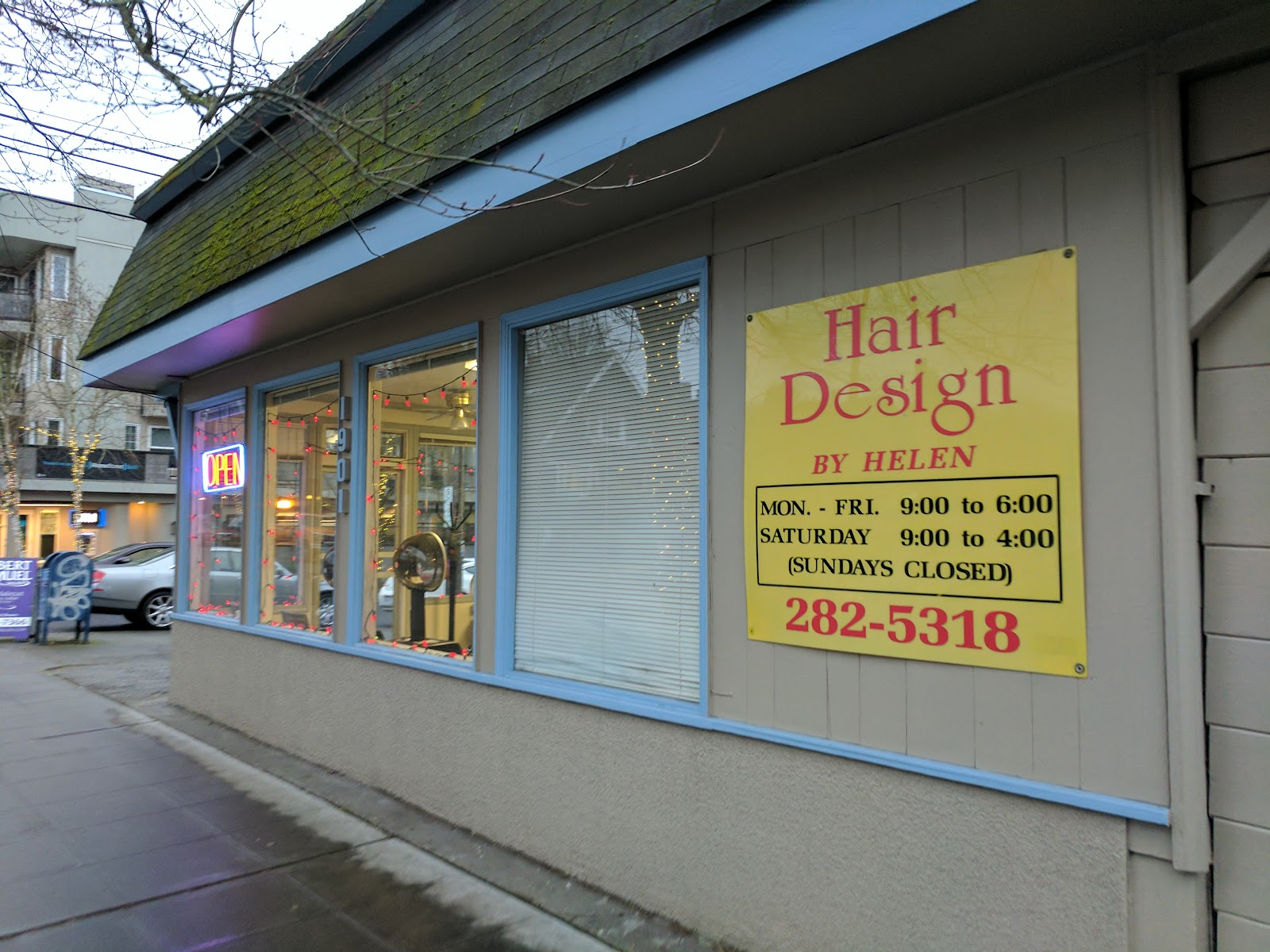Hand-painted sign on the storefront of Hair Design by Helen showing hours and phone number, Queen Anne, Seattle